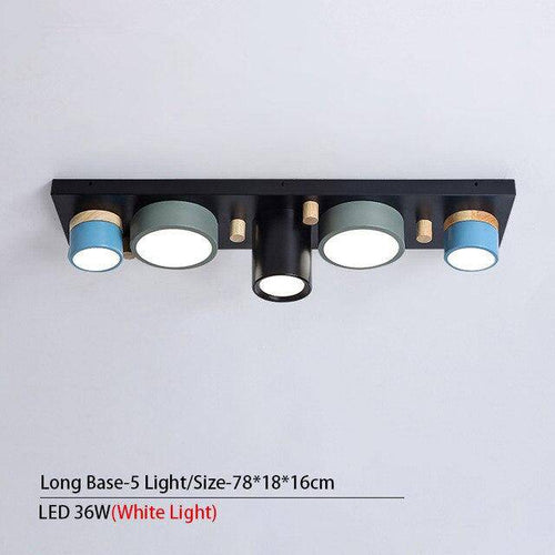Plafonnier design avec plusieurs spots cylindriques colorés à LED