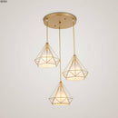 Lustre à suspensions à cages coniques dorées