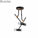 Suspension moderne à LED en métal noir et branches rétro