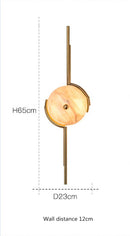 Applique murale design avec cercle en marbre et tiges dorées