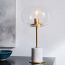 Lampe à poser design LED en marbre avec tige dorée et boule en verre