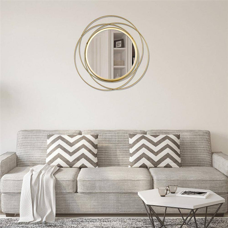 Miroir mural rond et anneaux dorés