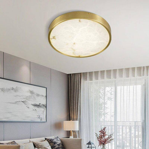 Plafonnier design LED rond en marbre avec bords dorés