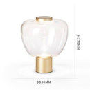 Minimalist designer LED table lamp with deformed glass shade