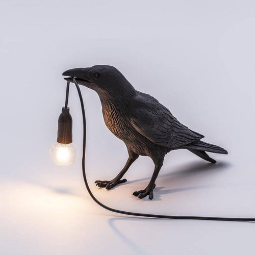 Applique murale LED avec oiseau qui tient une lampe dans son bec