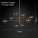 Lustre design LED base en métal doré et globes en verre Zuri