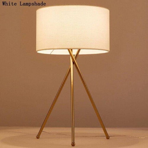 Lampe à poser design dorée avec abat-jour en tissu