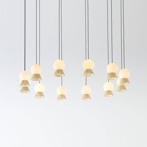 Suspension et lustre design à LED avec boule en verre et support dorée
